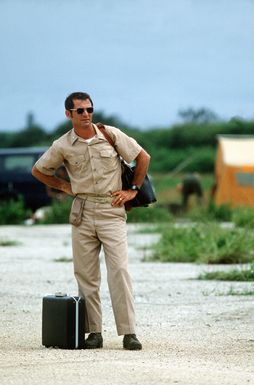 Navy CDR William E. Steep, special assistant for Trust Territory Affairs, waits to board a C-130 Hercules aircraft for a flight back to Guam during Exercise Kennel Bear '4-82