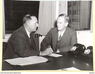 MELBOURNE, VIC. LEFT TO RIGHT: HON. T.J. COLLINS MHR, MINISTER IN CHARGE OF EXTERNAL TERRITORIES AND ASSISTANT MINISTER FOR INTERIOR, CONFERS WITH HON. HUBERT L. MURRAY, ADMINISTRATOR FOR PAPUA, ..