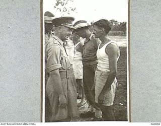 NEW GUINEA. 1943-11-20. NX8 LIEUTENANT GENERAL SIR LESLIE MORSHEAD KCB KBE CMG DSO ED, GENERAL OFFICER COMMANDING, NEW GUINEA FORCE CONGRATULATING WINNERS OF THE VARIOUS EVENTS AT THE CHAMPIONSHIP ..