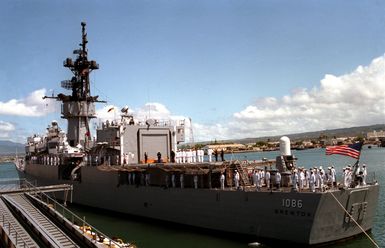 A port quarter view of the frigate USS BREWTON (FF 1086), during a ceremony to honor the Unknown Serviceman of the Vietnam Era. The BREWTON will transport the serviceman's casket to California, where it will then be transferred to Arlington, Virginia, for interment at Arlington National Cemetery