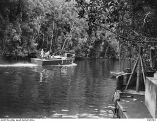 MOROBE, NEW GUINEA. 1943-08-13. AMERICAN LANDING BARGE OF THE UNITED STATES SMALL SHIPS SECTION, PROCEEDING UP THE CREEK TO THEIR DAYTIME HIDEOUT