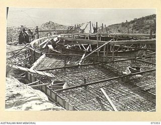 PORT MORESBY, NEW GUINEA. 1944-05-24. THE NO.1 GUN EMPLACEMENT AT BASILISK BATTERY, 801ST ANTI-AIRCRAFT AND COAST ARTILLERY BATTERY, HEADQUARTERS MORESBY BASE SUB-AREA VIEWED TOWARDS THE SOUTH WEST ..