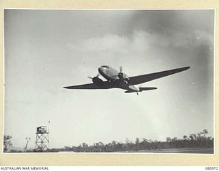 MAREEBA, QLD. 1944-09-30. A DOUGLAS C47 DAKOTA TRANSPORT AIRCRAFT TAKING OFF FOR NEW GUINEA. SENIOR OFFICERS OF HEADQUARTERS FIRST AUSTRALIAN ARMY WERE TRANSPORTED BY TWO OF THESE AIRCRAFT TO LAE