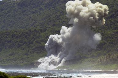 A tower of smoke rises above the 36th Explosive Ordnance Disposal (EOD) Tarague range seconds after the detonation of an M117 bomb, as a part of the flight's training, on Andersen Air Force Base (AFB), Guam