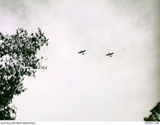 THE SOLOMON ISLANDS, 1945-04-24/27. TWO RNZAF CORSAIR AIRCRAFT OVER BOUGAINVILLE ISLAND. (RNZAF OFFICIAL PHOTOGRAPH.)