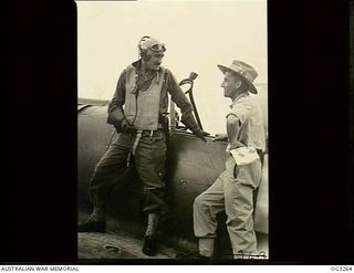 TOROKINA, BOUGAINVILLE ISLAND, SOLOMON ISLANDS. 1945-08-16. 402348 FLIGHT LIEUTENANT (FLT LT) H. H. GRIFFITHS, MOSMAN, NSW (LEFT), TELLS 403124 FLT LT W. N. CLERY, KURRI KURRI, NSW, INTELLIGENCE ..