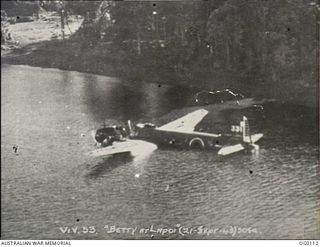 OFF NEW BRITAIN ISLAND, NEW GUINEA. 1943-09-21. A JAPANESE MITSUBISHI BOMBER AIRCRAFT, ALLIED CODE NAME "BETTY", WHICH WAS FORCED TO CRASH-LAND WHILE ATTEMPTING TO RETURN TO ITS BASE AT RABAUL