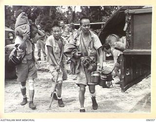 TOROKINA, BOUGAINVILLE. 1945-09-14. SOME OF THE MEMBERS OF THE PARTY OF 79 CHINESE WHO ARRIVED BY TRUCK AT TOROKINA COMPOUND. FORMER PRISONERS OF THE JAPANESE THEY WERE RELEASED WHEN AUSTRALIAN ..