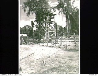 THE SOLOMON ISLANDS, 1945-10-18. WATCHTOWER AT THE JAPANESE INTERNMENT AREA AT TOROKINA, BOUGAINVILLE ISLAND. (RNZAF OFFICIAL PHOTOGRAPH.)