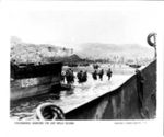 WORLD WAR II: SOLDIERS SWARMING ASHORE ON JAP HELD GUAM