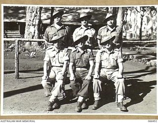 WONDECLA AREA, QUEENSLAND, AUSTRALIA. 1944-05-25. GROUP PHOTOGRAPH OF SIX OF THE 2/5TH INFANTRY BATTALION DECORATED PERSONNEL. NEARLY ALL THESE DECORATIONS WERE WON IN NEW GUINEA