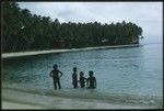 Children swimming at the coast