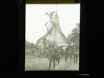 Men and boys in front of building, New Guinea, c1924 to ?