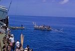 LIghters ferrying passengers between ship and shore