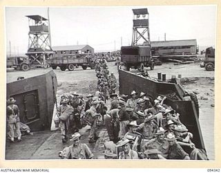 TOROKINA, BOUGAINVILLE. 1945-07-26. THE FIRST CONTINGENT OF "FIVE YEAR RELEASE PERSONNEL" TO LEAVE FOR THE RETURN TO AUSTRALIA. THESE MEN HAVE COMPLETED FIVE YEARS IN THE ARMY AND ARE BEING ..