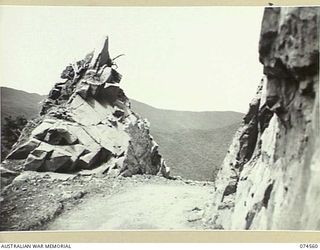 NEW GUINEA. 1944-07-09. A SECTION OF THE WAU-BULLDOG ROAD AS IT PASSES ALONG THE TOP OF A HIGH RIDGE