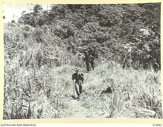 1944-04-17. NEW GUINEA. AUSTRALIAN PATROLS IN THE FINNISTERRES. THE COUNTRY IS ROUGH AND INHOSPITABLE AND SUPPLIES HAVE TO BE SUPPLIED BY NATIVE CARRIERS WHO OCCUPY FOUR-DAYS IN REACHING ADVANCED ..