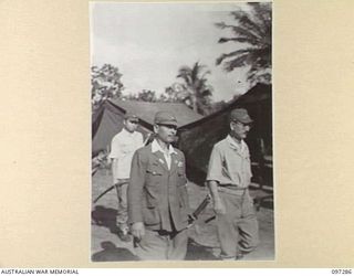 BUIN AREA, BOUGAINVILLE. 1945-09-13. JAPANESE MEDICAL REPRESENTATIVES ARRIVING AT HEADQUARTERS 2 CORPS SURRENDER PARTY CAMP IN THE KAHILI AREA TO DISCUSS WITH AUSTRALIAN OFFICERS ARRANGEMENTS FOR ..