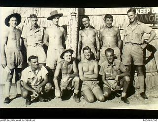 Port Moresby, New Guinea. 1943. Group portrait of members of a RAAF Bomb Disposal Unit. Left to right: back row: unidentified, Larry Appleby, 'Lofty', Lazarini, unidentified, unidentified. Front ..