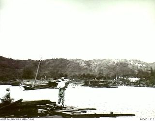 NEW BRITAIN, 1945-09. WAR DAMAGED BUILDING AND JAPANESE SHIPPING AT RABAUL. (RNZAF OFFICIAL PHOTOGRAPH.)
