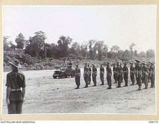 TOROKINA, BOUGAINVILLE. 1945-10-22. A CEREMONIAL PARADE AND MARCH PAST BY 29 INFANTRY BRIGADE WAS HELD FOR MAJOR GENERAL W. BRIDGEFORD, GENERAL OFFICER COMMANDING 3 DIVISION, AT TOROKINA AIRFIELD. ..