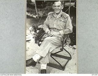 FINSCHHAFEN AREA, NEW GUINEA. 1944-03-20. VX221 BRIGADIER F.K. NORRIS, CBE, DSO, ED, (1), DEPUTY DIRECTOR OF MEDICAL SERVICES, AT HEADQUARTERS, 2ND AUSTRALIAN CORPS