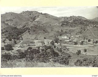 PORT MORESBY, NEW GUINEA. 1944-06-27. NO. 2 SORTING AREA OF THE 1ST BULK PETROLEUM STORAGE COMPANY, SHOWING D TANK IN THE BACKGROUND. TO JOIN TO PHOTOGRAPHS NO. 74088 AND 74089