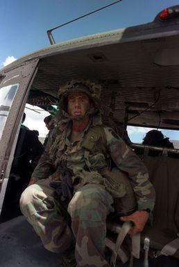 Captain (CPT) Richard S. Hendricks, Company commanders, Company A, 1ST Battalion, 5th Infantry, 25th Infantry Division, leads his company in an airmobile assault aboard UH-1 Iroquois helicopters during exercise OPPORTUNE JOURNEY 4-84 at Pohakuloa Training Area