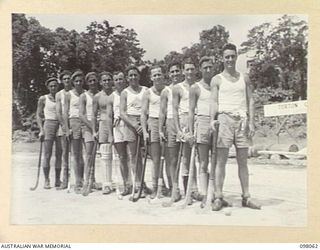 TOROKINA, BOUGAINVILLE, 1945-10-15. THE HEADQUARTERS 2 CORPS HOCKEY TEAM. THE TEAM PLAYED 11 FIELD AMBULANCE HOCKEY TEAM IN THE BOUGAINVILLE ASSOCIATION HOCKEY FINAL AT TURTON OVAL