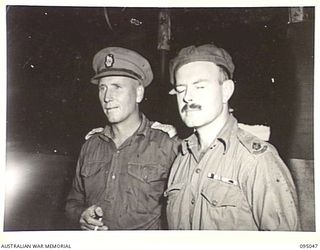 TOKO, BOUGAINVILLE. 1945-08-18. FIRST CONTACT BETWEEN THE JAPANESE SURRENDER ENVOY AND AUSTRALIAN TROOPS ON BOUGAINVILLE. SHOWN, MAJOR J R BURRELL (2), WHO MET THE JAPANESE ENVOY AT THE MIVO RIVER ..