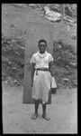 Man in front of wood plank