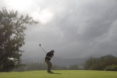 Barack Obama plays golf with Prime Minister Najib Razak, Joe Paulsen, and Mike Brush in Kaneohe Bay, Hawaii, December 24, 2014