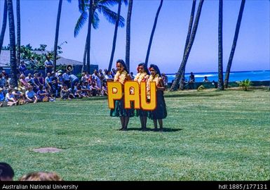 Kodak Hula Show - dancers holding letters spelling 'Pau'