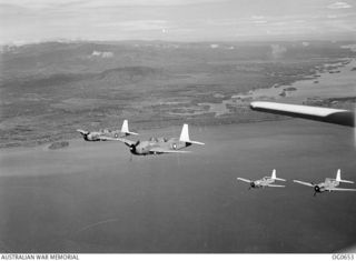 NEAR ALEXISHAFEN, NEW GUINEA. 1944-02-27. IN FLIGHT, VULTEE VENGEANCE DIVE BOMBER AIRCRAFT OF NO. 24 SQUADRON RAAF RETURNING FROM AN AIR RAID ON THE JAPANESE-HELD AIRSTRIP ON THE NORTH COAST OF NEW ..