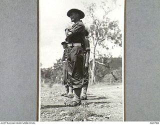 POM POM VALLEY, NEW GUINEA. 1943-11-27. SX12030 LEITUENANT E. C. S. MELDRUM, GUARD OFFICER, INSPECTING MEMBERS OF THE 2/10TH AUSTRALIAN INFANTRY BATTALION GUARD, THE CHAMPION GUARD UNIT OF THE 18TH ..