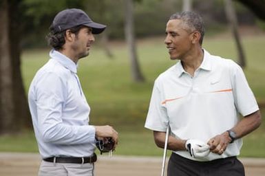 Barack Obama plays golf with Prime Minister Najib Razak, Joe Paulsen, and Mike Brush in Kaneohe Bay, Hawaii, December 24, 2014