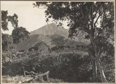 Mission Station, Boianai [with mountains in background] / Frank Hurley