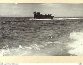 KELANOA, NEW GUINEA. 1944-01-24. A LANDING CRAFT MECHANIZED LOADED WITH MEN OF THE 30TH INFANTRY BATTALION. TWO OF THESE CRAFT CARRIED THE BATTALION'S "D" COMPANY FULLY EQUIPPED FROM KELANOA TO SIO