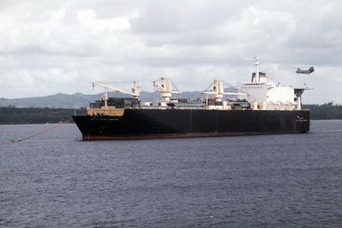 A port bow view of the Military Sealift Command (MSC) chartered maritime prepositioned ship 1ST LT JACK LUMMUS (T-AK-3011) anchored in the harbor during exercise Tempo Brave '94