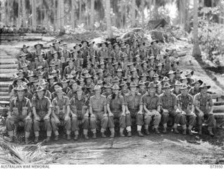 MADANG, NEW GUINEA. 1944-06-17. GROUP PORTRAIT OF OFFICERS AND OTHER RANKS OF C COMPANY, 58/59TH INFANTRY BATTALION. LEFT TO RIGHT: FRONT ROW: VX138402 SERGEANT J. THIRKELL; VX140443 WARRANT ..