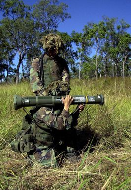 Marines from India Company, 3rd Battalion, 3rd Marines weapon platoon, Kaneohe Bay, Hawaii prepare to fire their M136 AT4 Shoulder Mounted Anti-Armor Weapon during Exercise TANDEM THRUST. India Company is conducting a live fire range exercise consisting of firing AT-4 Rocket Launchers, Shoulder Mounted Anti Armor Weapons, and M-2O3 Grenade Launchers at the Shoalwater Bay Training Area. TANDEM THRUST is a biennial combined United States and Australian military training exercise, held in the vicinity of Shoalwater Bay Training Area in Queensland, Australia. More than 27,000 Soldiers, Sailors, Airmen and Marines are participating, with Canadian units taking part as opposing forces. The...