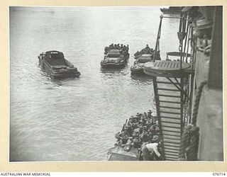 MILFORD HAVEN, LAE, NEW GUINEA. 1944-11-01. TROOPS OF THE 4TH FIELD REGIMENT COMING ABOARD THE AMERICAN LIBERTY SHIP, LINDLEY M. GARRISON FOR THE UNIT MOVEMENT TO BOUGAINVILLE ISLAND