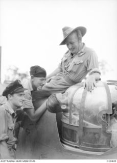 KIRIWINA, TROBRIAND ISLANDS, PAPUA. C. 1944-01. FLIGHT SERGEANT G. BENNEWITH OF FREMANTLE, WA, WHO WAS IN THE TURRET, AND HAD A LUCKY ESCAPE WHEN A PIECE OF SHRAPNEL SMASHED THE PERSPEX OF THIS ..