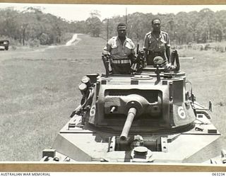 SOUTHPORT, QLD. 1944-01-18. NEW GUINEA POLICE BOYS RIDING IN A MATILDA TANK OF THE 4TH ARMOURED BRIGADE