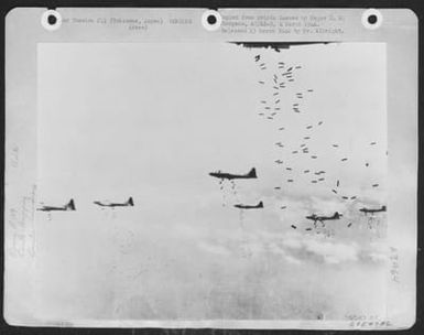 B-29S Of The 497Th Bomb Group, 73Rd Bomb Wing, Based On Saipan Shower Another Load Of Incendiaries On Yokohama, Japan. (U.S. Air Force Number 59547AC)