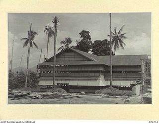 ALEXISHAFEN, NEW GUINEA. 1944-07-16. A NEW WARD FOR THE 2/15TH FIELD AMBULANCE NEARING COMPLETION IN THE CATHEDRAL GROUNDS