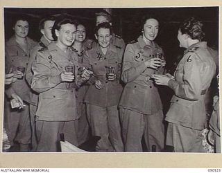 LAE, NEW GUINEA. 1945-03-26. AUSTRALIAN ARMY NURSING SERVICE PERSONNEL AT THE SISTERS MESS, 2/7 GENERAL HOSPITAL, DURING THE VISIT OF LADY WAKEHURST AND LADY BLAMEY. IDENTIFIED PERSONNEL ARE:- ..