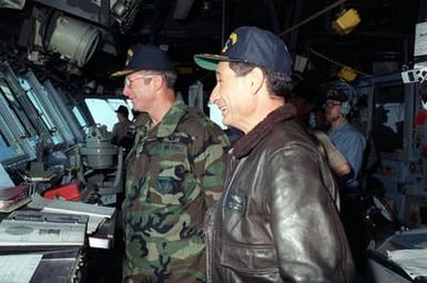 LT. GEN. Peter T. Kempf, right, commander, 12th Air Force, tours the bridge of the amphibious assault ship USS SAIPAN (LHA-2) with the ship's commanding officer during the joint services exercise Solid Shield '89