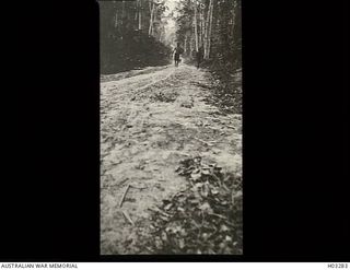 Kabakaul, New Britain. c. 1915. Two natives on the road between Kabakaul and Bitapaka