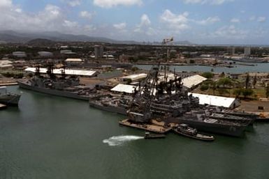 An aerial view of the guided missile cruisers USS JOUETT (CG 29), USS WILLIAM H. STANDLEY (CG 32) and USS GRIDLEY (CG 21), moored at berth K-3 during Exercise RIMPAC '86